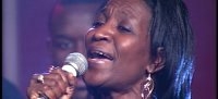 MARIE FAIRLEY LEADS ONE OF THE CHOIR SONGS...