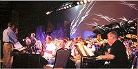 DR. KENT KIDWELL WARMS UP THE HALL OF FAME ORCHESTRA FOR REHEARSAL...