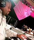 MICHAEL WILKINSON, JR. CHECKS HIS KEYBOARD DURING REHEARSAL...